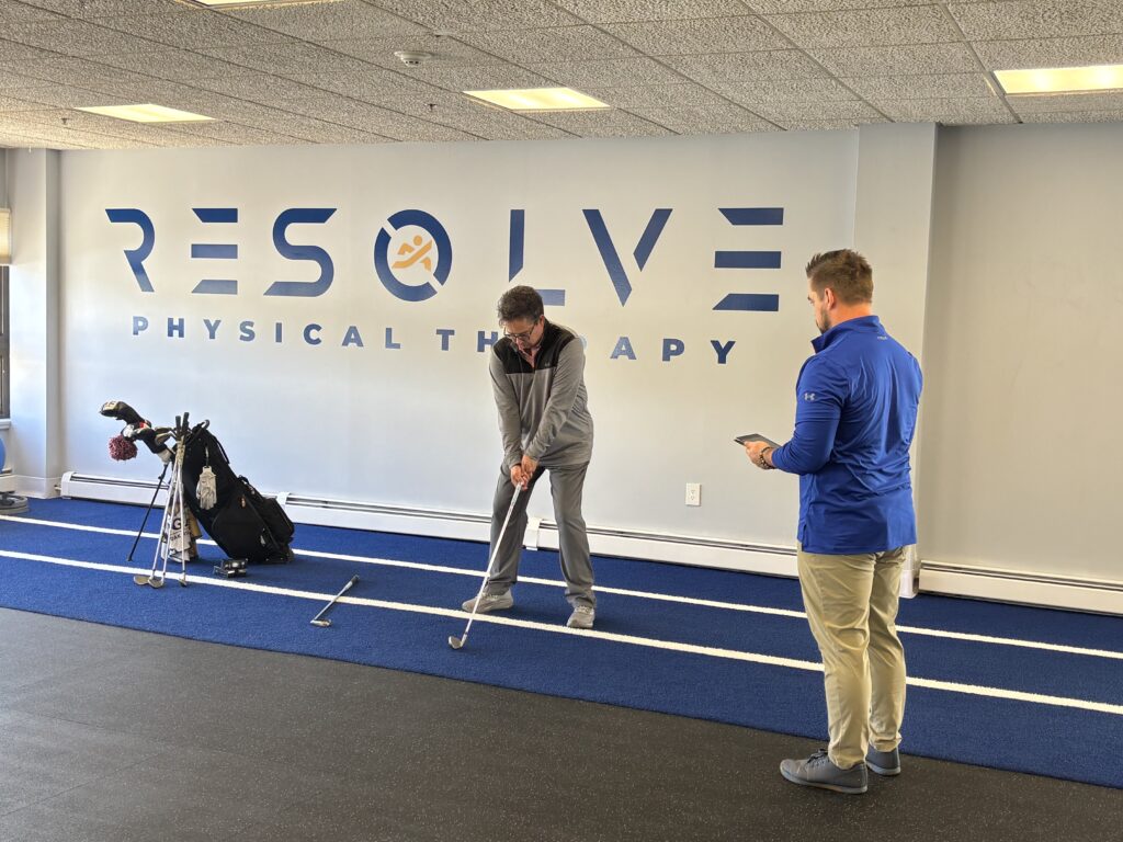 Golfer performing TPI golf assessment at Resolve Physical Therapy